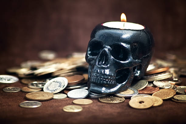 istock Close up skull candleholder with coins 158234321