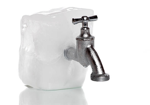 frozen water-tap on ice rock
