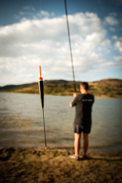 Lakeside fishing stock photo