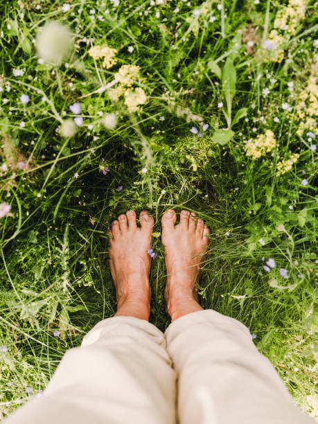 istock barefoot feet grounding in summer grass outdoors in nature 1582347185