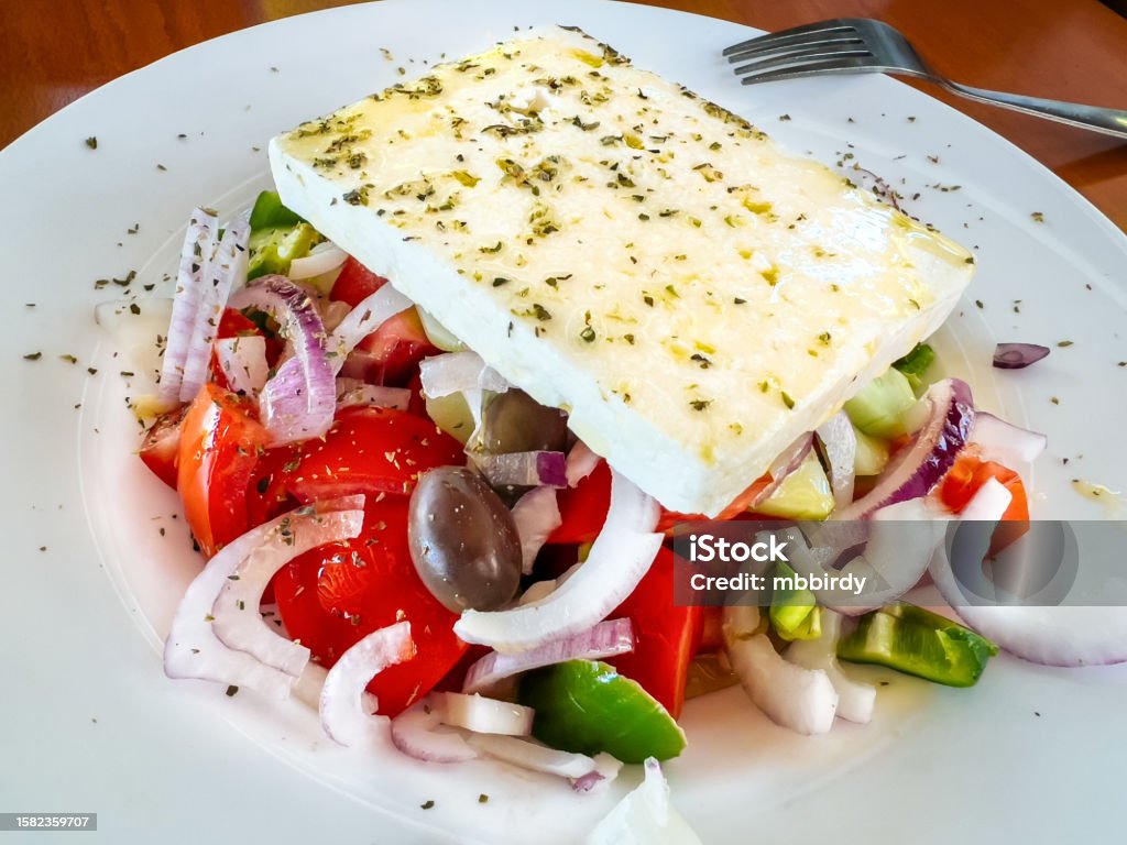 Greek salad, close-up Original Greek salad close-up in tavern. Bowl Stock Photo