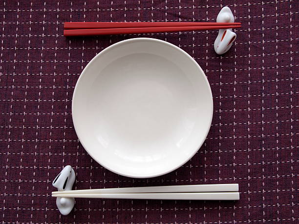 chopsticks and rounded plate stock photo