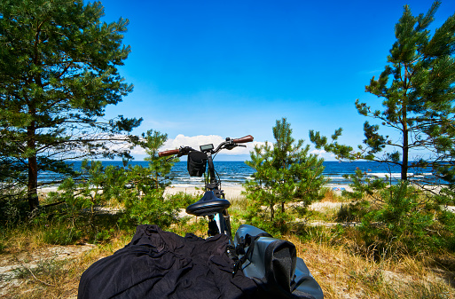 Bike parked in the dunes on the northern edge of the Curonian Spit in Poland during a bike tour of Poland