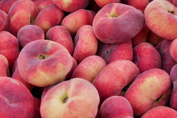istock Saturn peach or chinese flat peaches 1582419093