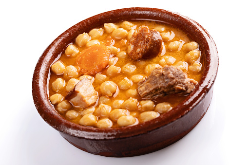 Close up of cocido madrileño on white background