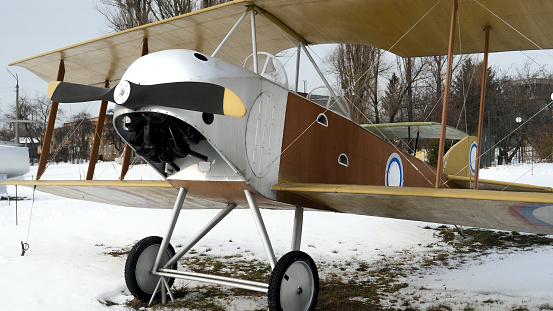 Old retro biplane in open-air museum. Ukraine, Kyiv, Zhulyani museum, January 2022.