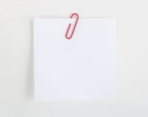 Paper clip holding a blank stock photo