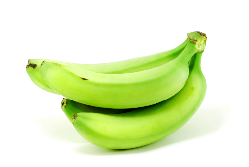 green bananas isolated on white