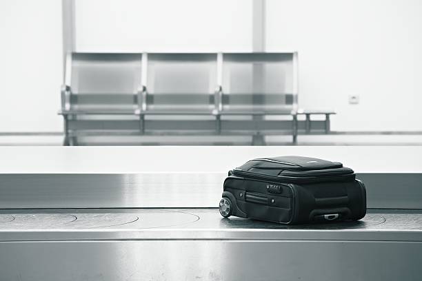 Baggage Claim Baggage claim at the airport carousel photos stock pictures, royalty-free photos & images