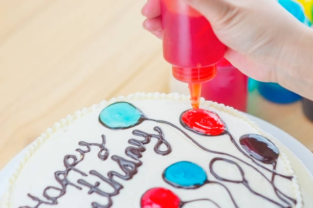 istock Birthday cake decoration using red yam making a colorful balloon 1582466916