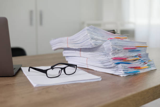 istock Business Documents concept  document achieves on folders papers at busy work desk office 1582497759