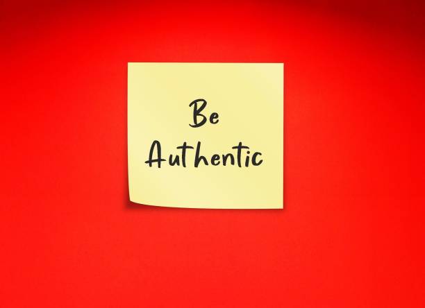 istock On red background, red note written BE AUTHENTIC, concept of being true authentic self, express whole self genuinely, start with self-awareness and self-acceptance 1582498974