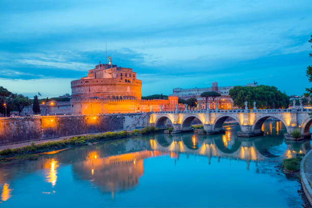 istock Saint Angel Castle (Castle Saint Angelo) at  twilight blue hour - Rome, Italy 1582500563