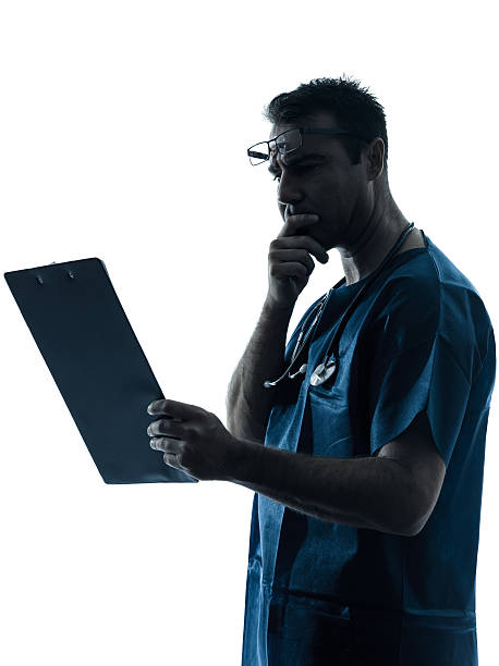 istock doctor man medical exam silhouette 158251502