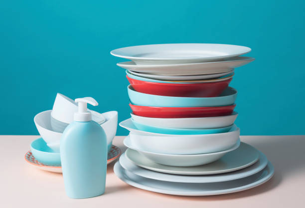 istock Pile of clean dishes and dish detergent 1582515512