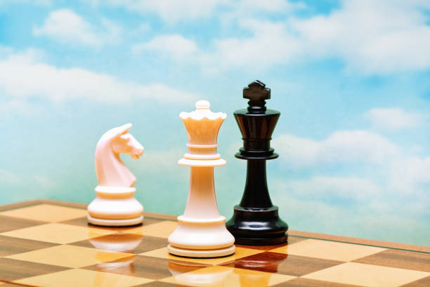 istock Checkmate! White queen defeats black king in a game of chess 1582520259