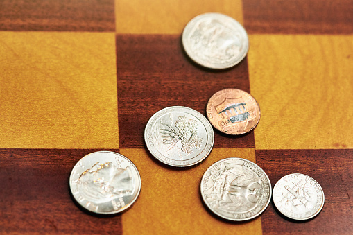 American coins on a chess board.