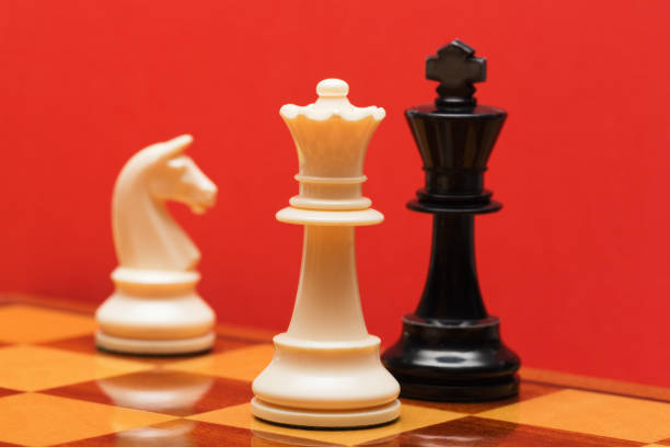 istock Checkmate! White queen defeats black king in a game of chess 1582527959
