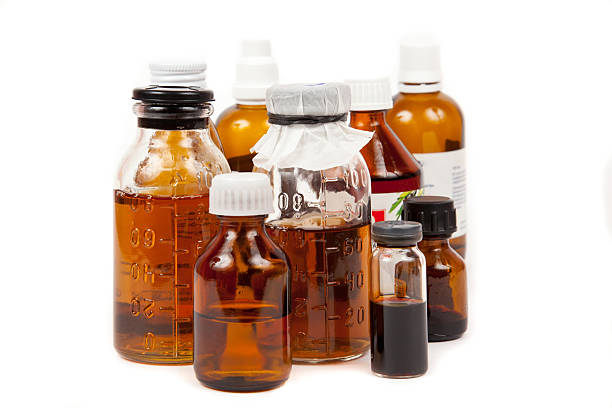 istock bottles medical with a potion on  white background 158255692