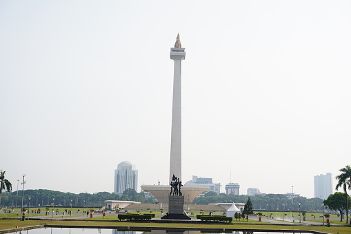 The National Monument (Indonesian: Monumen Nasional, abbreviated Monas) is a 132 m (433 ft) obelisk in the centre of Merdeka Square, Central Jakarta. It is the national monument of the Republic of Indonesia, built to commemorate the struggle for Indonesian independence. Construction began in 1961 under the direction of President Sukarno. Monas was opened to the public in 1975. It is topped by a flame covered with gold foil. On 17 August 1954, a National Monument Committee was established and a design competition was held in 1955. This attracted 51 entries, but only one design, by Friedrich Silaban, met any of the criteria determined by the committee, which included reflecting the character of Indonesia in a building capable of lasting for centuries. A repeat competition was held in 1960, but once again, none of the 136 entries met the criteria. Monas was officially opened to the public on 12 July 1975