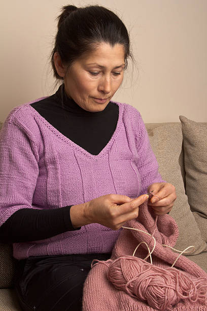 istock Asian Woman Sitting In Sofa, Knitting 158256696