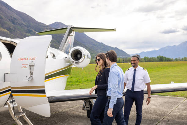 istock Successful couple traveling with a private jet plane 1582568091