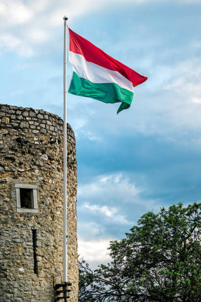 istock Hungarian flag on medieval bastion in Pecs, Hungary 1582568643
