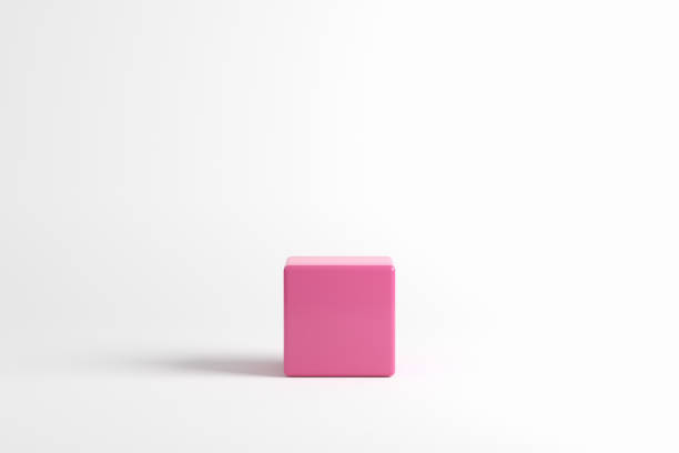 istock Pink cube podium or platform on white background for product display and presentation. 1582575265
