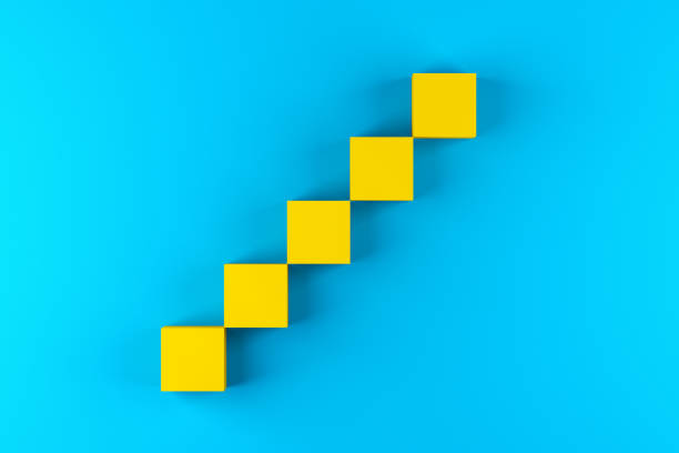 Blank yellow cube blocks arranged as step stairs ladder of success on blue background.