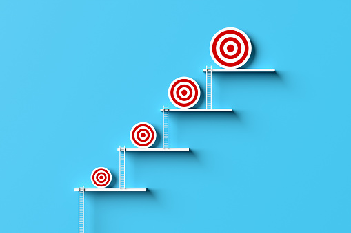 Target goal setting and goal improvement. Improving business or personal self development goals. Ladder of success and achievement. 3D render.