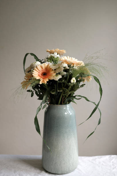 istock beautiful bouquet in a green large vase on the table 1582584437