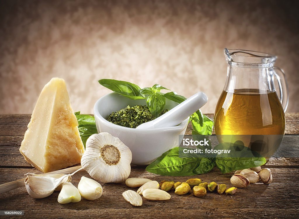 Sicilian pesto Sicilian pesto ingredients on wooden table Pistachio Stock Photo