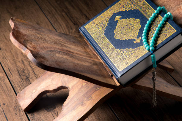 istock The Holy Al Quran with written Arabic calligraphy 1582593086