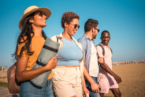 istock Diverse Friends Creating Memories on a Beach Day 1582603318