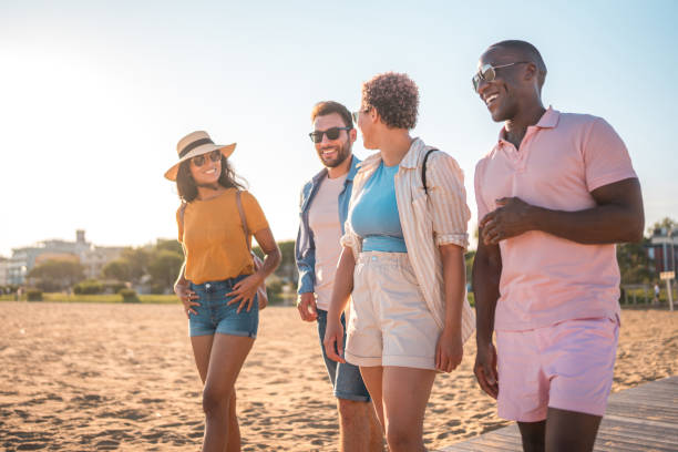 istock Young People On A Lively Beach Day 1582603350