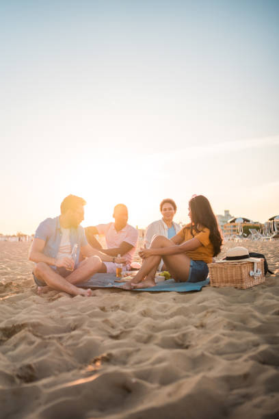 istock Coastal Chill With Cool Friends At The Beach 1582605443