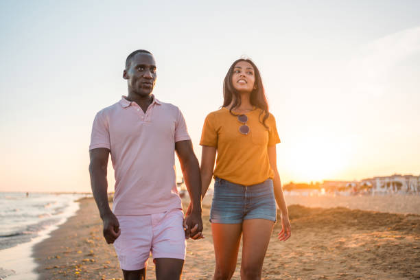 istock Mid Adult Lovebirds On A Romantic Beach Stroll Together 1582608873