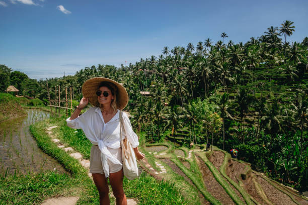 istock Woman enjoying Bali rice fields 1582620820
