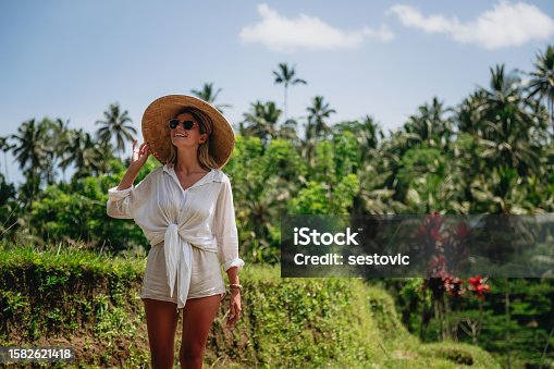 istock Woman enjoying Bali rice fields 1582621418
