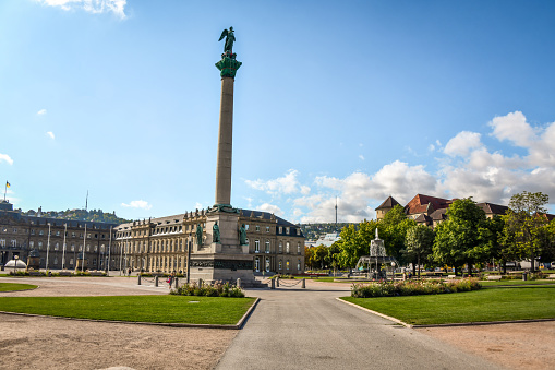 The Jubilee Column is a 30 meter high column, commemorating the 25th anniversary (1841) and the 60th birthday of king Wilhelm I. von Württemberg in 1846. Building started in 1842 after design by architect was Johann Michael von Knapp and in 1846 it was finished. The statues and reliefs were made by the sculptor Theodor Wagner. The statues represent the four estates; three of the four reliefs represent the king's military successes against Napoleon Bonaparte, only one is devoted to a political event. In 1863 a 5 m high statue of Concordia by Ludwig von Hofer was placed on the top.  The Dominant Building is Ministry of Economics, Labor and Tourism Baden-Württemberg as part of the New Palace In Stuttgart.