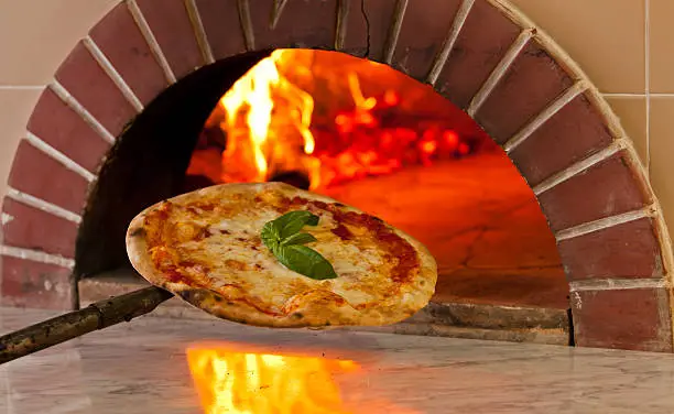 Pizza cooked in a wood oven