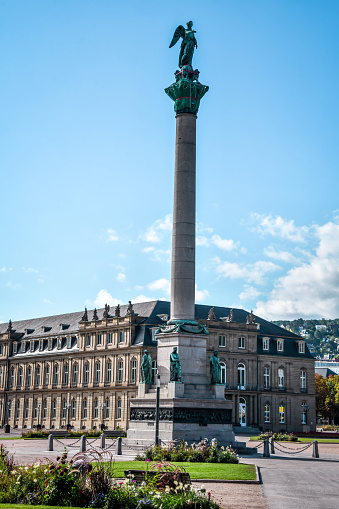 The Jubilee Column is a 30 meter high column, commemorating the 25th anniversary (1841) and the 60th birthday of king Wilhelm I. von Württemberg in 1846. Building started in 1842 after design by architect was Johann Michael von Knapp and in 1846 it was finished. The statues and reliefs were made by the sculptor Theodor Wagner. The statues represent the four estates; three of the four reliefs represent the king's military successes against Napoleon Bonaparte, only one is devoted to a political event. In 1863 a 5 m high statue of Concordia by Ludwig von Hofer was placed on the top.  The Dominant Building is Ministry of Economics, Labor and Tourism Baden-Württemberg as part of the New Palace In Stuttgart.