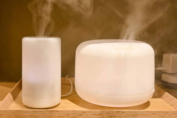 istock Aroma composition in different shape with a modern aroma oil diffuser on a wooden surface 1582635574