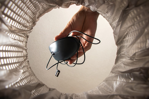 Upcycled Computer Mouse Throwing A Computer Mouse In The Trash Bin A Computer Mouse In Hand ...