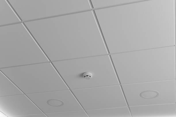 istock smoke fire alarm detector. installed on the white ceiling in the building with copy space. 1582658862
