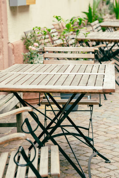 istock decorative wooden chairs with table in front of a house 1582663185