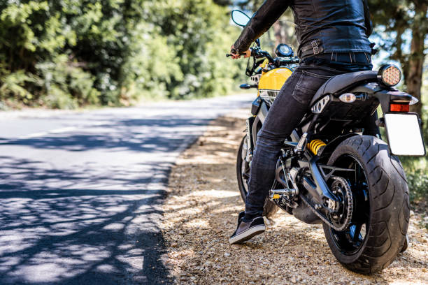 istock Man on motorbike starting ride 1582663702