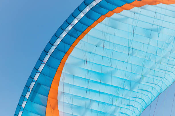 istock Colorful paraglider close-up against the blue sky 1582668214