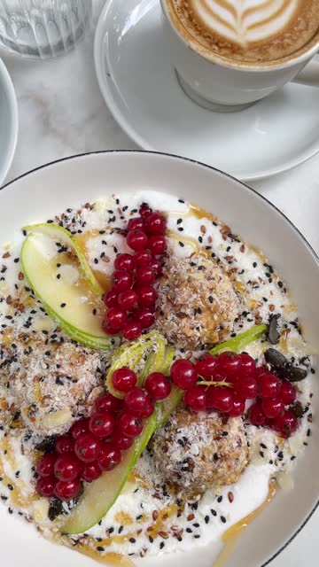 Porridge with fresh red currant at the cafe