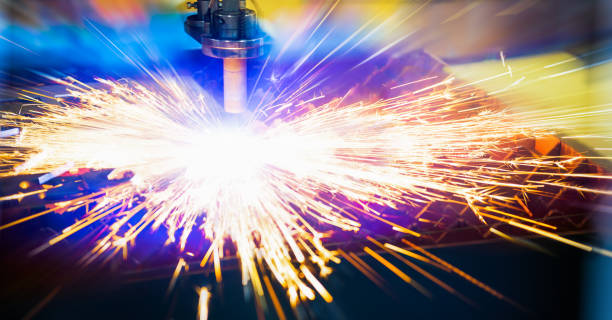 istock Laser cutting of metal with sparks 1582676441